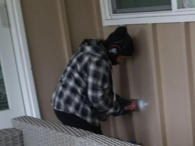 Professional electrician installing an exterior outlet in Powell